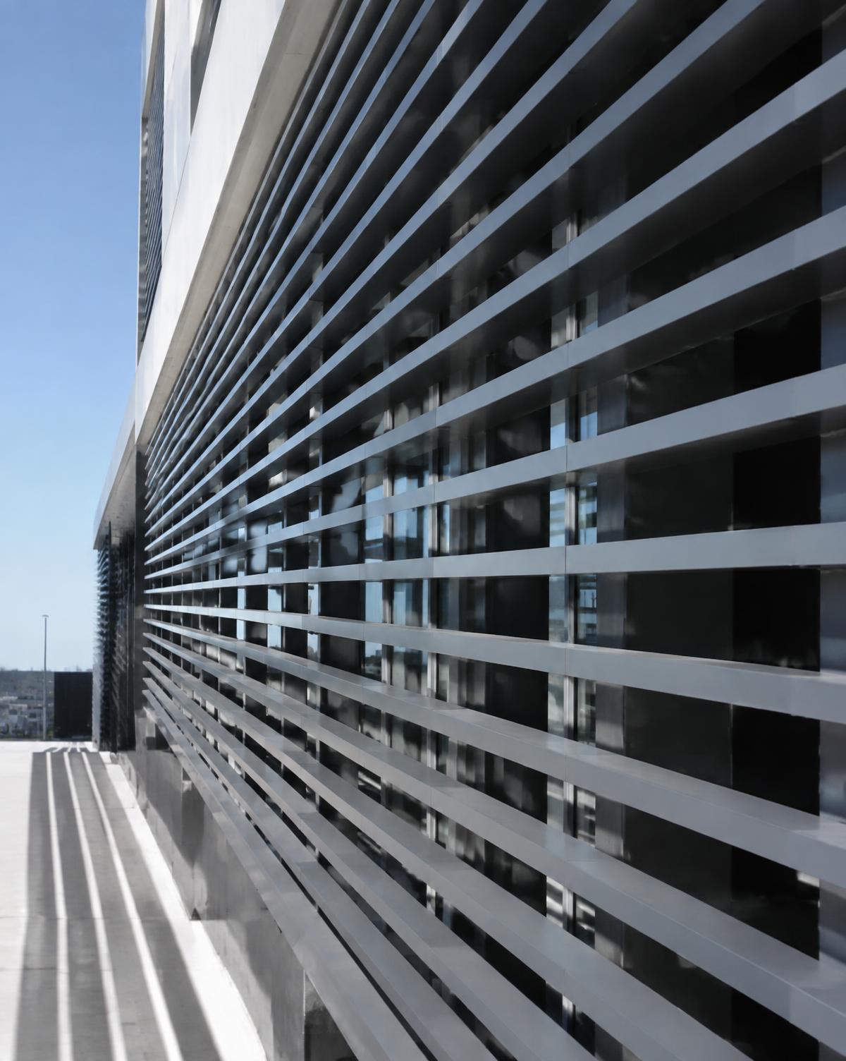 Aluminum louver screen system on a commercial building facade