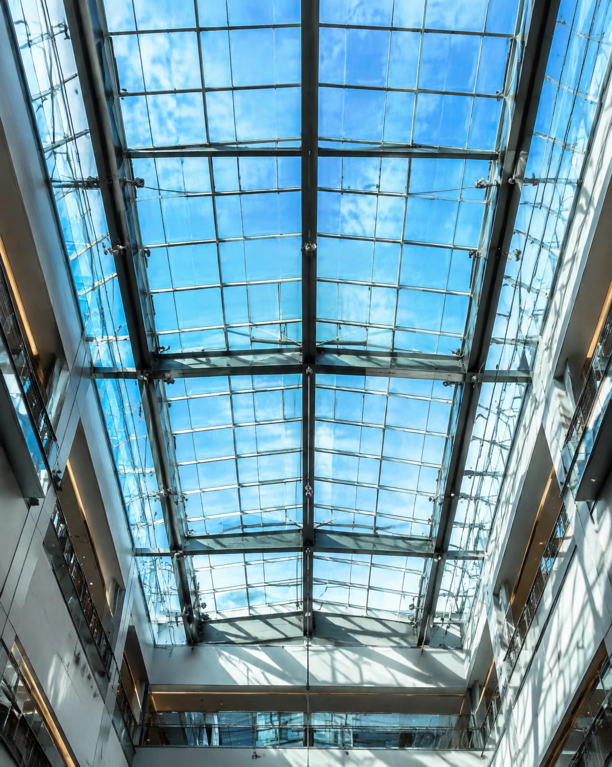 Commercial glass skylight roof over an atrium